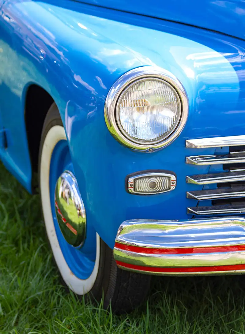 Vintage blue car's headlight